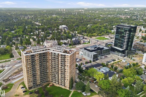 Aerial perspective highlighting the surrounding urban landscape with extensive tree canopy - #1115 13910 Stony Plain Rd Nw, Edmonton, AB 