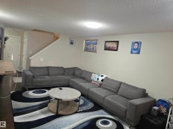 Recessed lighting, wood-finish flooring, and light-toned walls - 