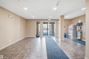 Tiled flooring with a neutral wall palette, recessed ceiling lighting, and glass entry doors - #212 12035 22 Av Sw, Edmonton, AB 