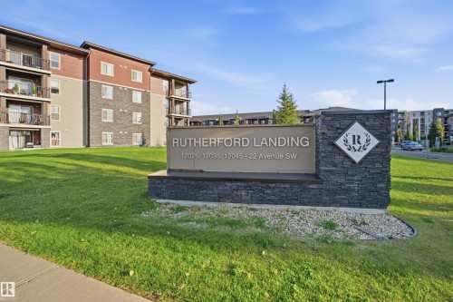Stone-clad monument sign with raised lettering - #212 12035 22 Av Sw, Edmonton, AB 