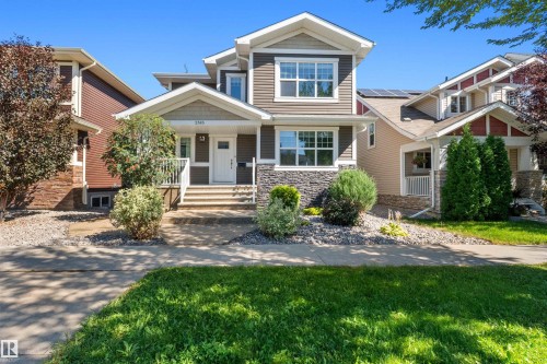 Craftsman-style facade with stone accents, horizontal siding, and multiple gables - 2585 Pegasus Boulevard Nw, Edmonton, AB 