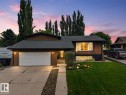 Contemporary stucco exterior with a gray shingle roof and an integrated single-car garage - 131 Pine Drive, Wetaskiwin, AB  - Outdoor 