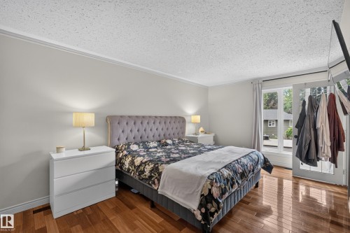 Hardwood-style flooring throughout - 131 Pine Drive, Wetaskiwin, AB - Indoor Photo Showing Bedroom