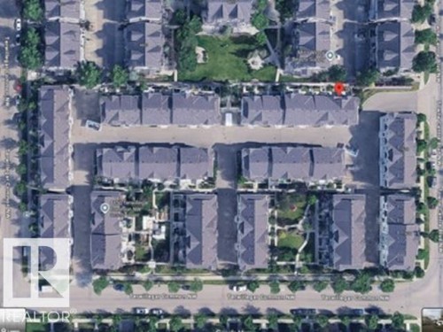 Aerial View, Property. An overhead perspective of the property and its surrounding structures - #18 4850 Terwillegar Cm Nw, Edmonton, AB 