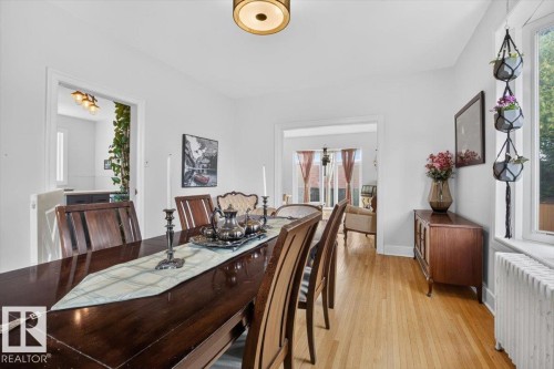 Hardwood flooring, cased openings, and a ceiling-mounted light fixture - 17107 80 Avenue Nw, Edmonton, AB 