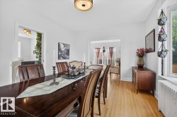Hardwood flooring, cased openings, and a ceiling-mounted light fixture - 