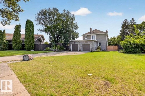 Two-story residence featuring gray siding and a shingled roof - 17107 80 Avenue Nw, Edmonton, AB 