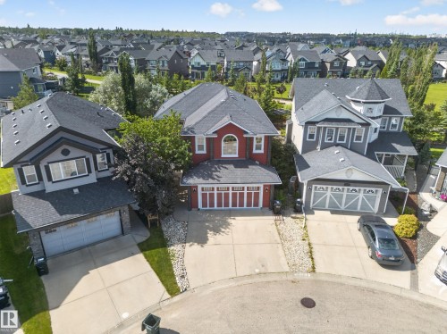 Neighborhood setting featuring multiple detached homes with diverse architectural styles, asphalt shingle roofs, and concrete driveways - 1223 Appleton Close, Sherwood Park, AB 