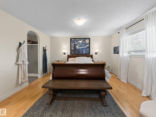 Hardwood flooring, arched doorway, recessed shower, flush-mount ceiling light, wall sconces - 1223 Appleton Close, Sherwood Park, AB 