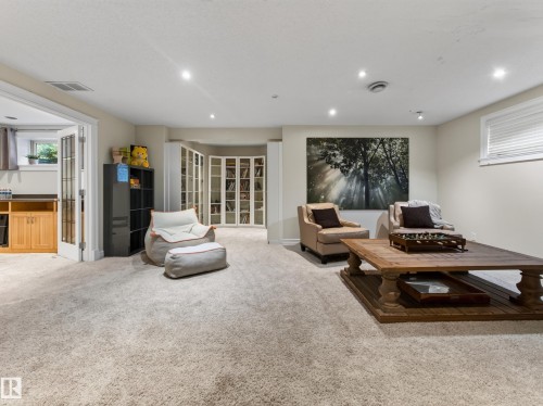 Recessed lighting illuminates the carpeted floor - 1223 Appleton Close, Sherwood Park, AB 