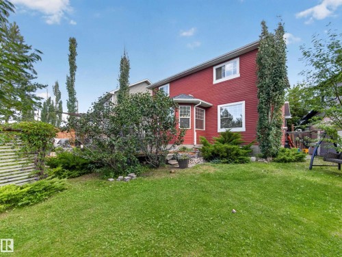 Expansive grassy yard with mature trees and established landscaping - 1223 Appleton Close, Sherwood Park, AB 