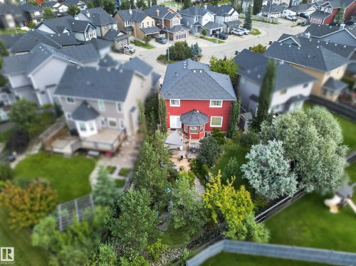 Two-story exterior with red siding and a dark roof - 1223 Appleton Close, Sherwood Park, AB 