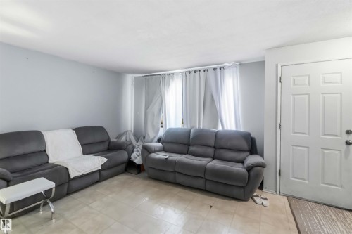 Light-toned tiled flooring extends across the space - 13408 67 Street Nw, Edmonton, AB 