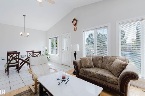 Vaulted ceiling, ceiling fan, multiple windows, tiled flooring, wood-finish flooring - 8517 156 Avenue Nw, Edmonton, AB 