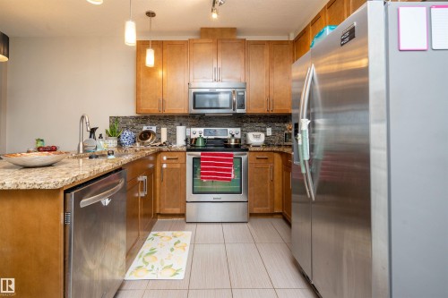 Kitchen - #610 5151 Windermere Bv Sw, Edmonton, AB - Indoor Photo Showing Kitchen With Stainless Steel Kitchen