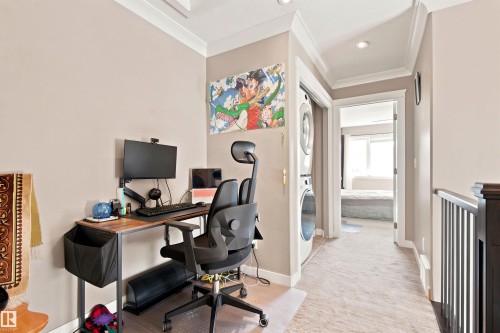 Upper-level hallway with crown molding, recessed lighting, and carpet flooring - 10833 63 Avenue Nw, Edmonton, AB 