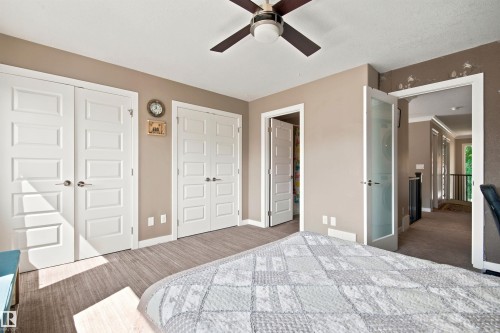 Recessed panel doors, ceiling fan, and frosted glass door - 10833 63 Avenue Nw, Edmonton, AB 
