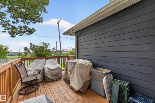 Outdoor wood-finish deck featuring a wood railing - 4204 47 Street, Wetaskiwin, AB - Outdoor With Deck Patio Veranda With Exterior
