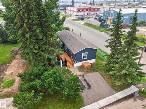 Single-story dwelling with dark blue siding and a dark shingle roof - 4204 47 Street, Wetaskiwin, AB - Outdoor