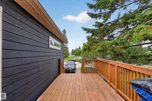 Expansive outdoor deck featuring wood decking and a matching wood railing - 4204 47 Street, Wetaskiwin, AB - Outdoor With Deck Patio Veranda With Exterior