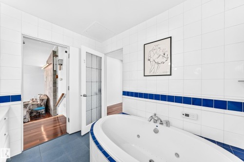 White tiled walls with a blue accent border - 3311 104 Avenue Nw, Edmonton, AB 
