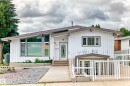 Contemporary exterior architecture with a gently sloped roofline, an accessible ramp, and a concrete driveway - 3311 104 Avenue Nw, Edmonton, AB 