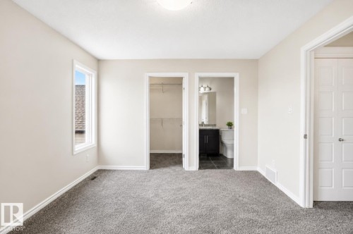 Light-toned wall finish, gray carpeting, single window, and white trim - 445 Watt Boulevard Sw, Edmonton, AB 