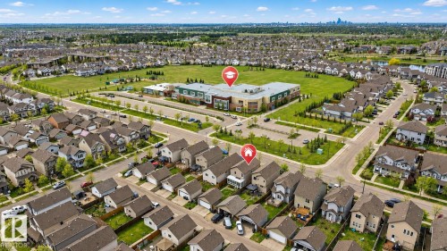 Residential neighborhood setting with tree-lined streets and varied housing styles - 445 Watt Boulevard Sw, Edmonton, AB 