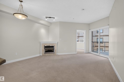 #212 2035 Grantham Ct Nw, Edmonton, AB - Indoor With Fireplace