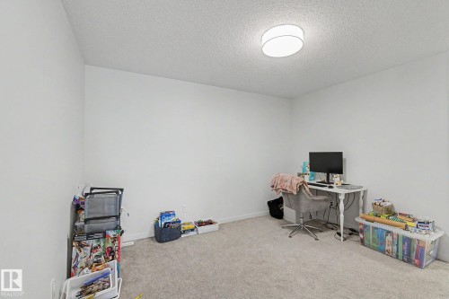 Room with light-colored carpeting and white walls - #12 905 172 St Sw, Edmonton, AB - Indoor Photo Showing Office
