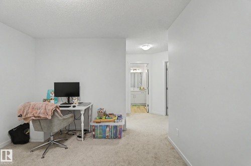Carpeted interior space with a neutral color palette - #12 905 172 St Sw, Edmonton, AB - Indoor Photo Showing Office