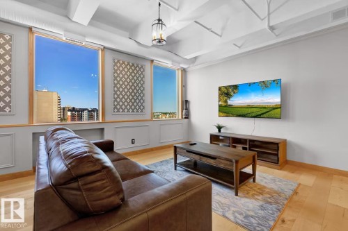 Light wood-finish flooring with crisp white walls - #903 10105 109 St Nw, Edmonton, AB 