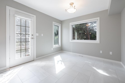 Light grey walls complement the white tile flooring, offering a neutral foundation - 14 Highlands Place, Wetaskiwin, AB 