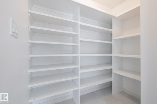 Built-in shelving with multiple storage levels - 14 Highlands Place, Wetaskiwin, AB 
