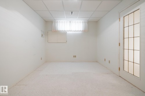 Recessed lighting, wall-to-wall carpeting, and a glass-paneled door - 14 Highlands Place, Wetaskiwin, AB 