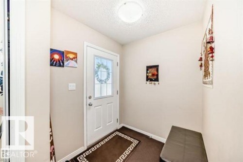 White entry door with decorative glass inserts - 625 56 Street Sw, Edmonton, AB 