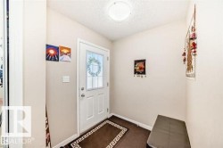 White entry door with decorative glass inserts - 