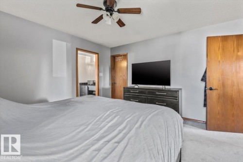 Recessed lighting and ceiling fan with wood-finish blades - 8015 158 Ave Nw, Edmonton, AB 