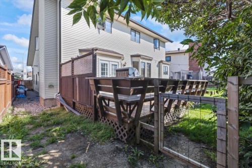 Raised wood deck with privacy lattice and built-in benches - 8015 158 Ave Nw, Edmonton, AB 