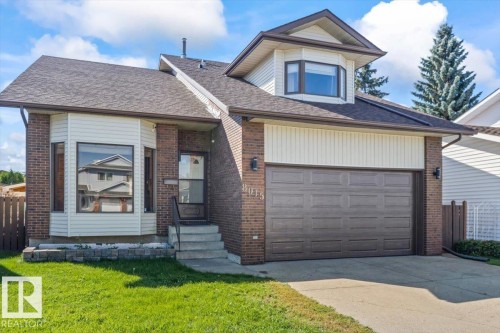 Brick and siding exterior with a pitched roof - 8015 158 Ave Nw, Edmonton, AB 