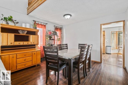 Wood-finish flooring throughout - 8015 158 Ave Nw, Edmonton, AB 