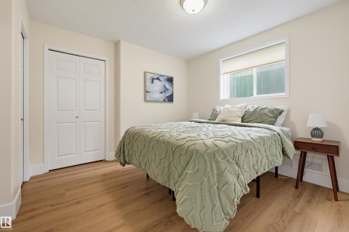 Wood-finish flooring with neutral wall tones - 839 Blacklock Way Sw, Edmonton, AB 