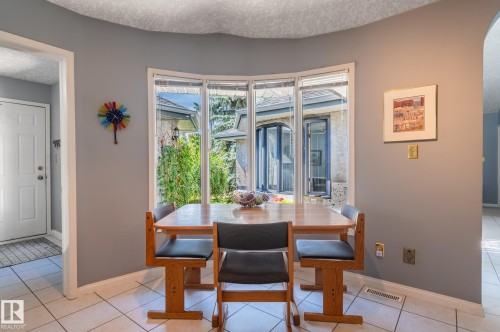 Bay window with exterior landscaping, light gray walls, and white tile flooring - 8 Edgemont Point(E), St. Albert, AB 