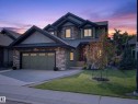Stone and siding exterior with dark trim accents - #59 10550 Ellerslie Rd Sw, Edmonton, AB  - Outdoor With Facade 