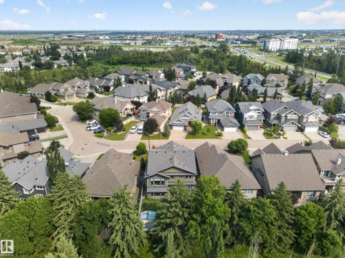 Residential neighborhood featuring diverse architectural styles, mature landscaping, and established roadways - #59 10550 Ellerslie Rd Sw, Edmonton, AB - Outdoor With View