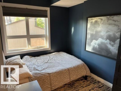 Window with white trim and horizontal blinds - #407 11103 84 Av Nw, Edmonton, AB 