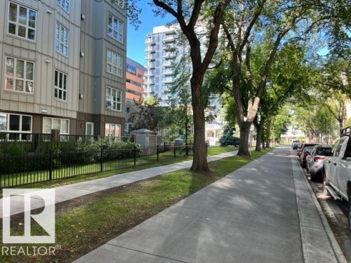 Contemporary multi-story building featuring paneled siding and multiple windows - #407 11103 84 Av Nw, Edmonton, AB 