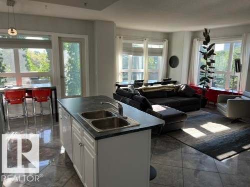 Kitchen island with double basin stainless steel sink - #407 11103 84 Av Nw, Edmonton, AB 