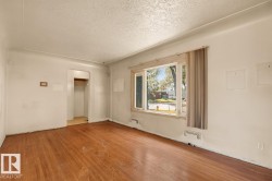 Hardwood flooring, bay window, and a built-in closet - 