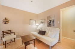Light-toned wood-finish flooring complements neutral wall tones - 